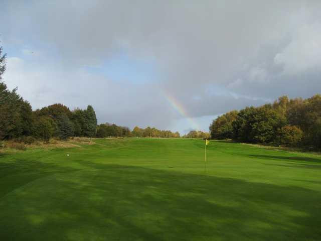 The beautiful 4th hole with a rainbow in the backdrop at  Penn Golf Club