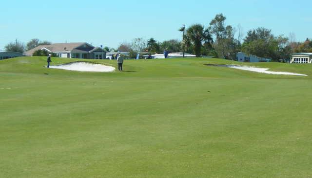 A view of the 1st green protected by bunkers at Barefoot Bay Golf & Recreation Park