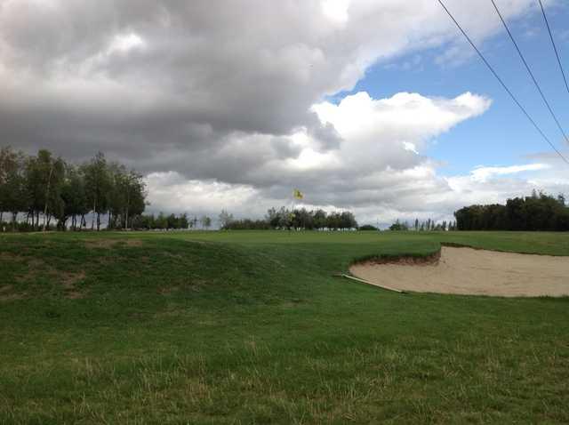 The 4th green and greenside bunker at South Cerney Golf Club