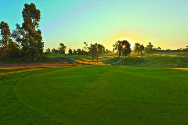 Sunset view of a green at The Golf Club at Rancho California