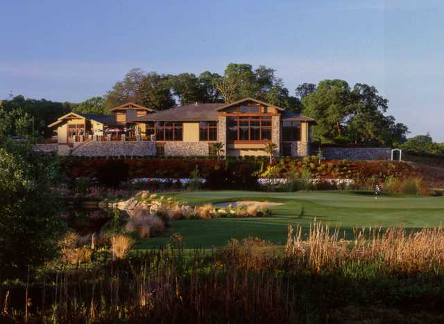 View of the clubhouse and the finishing hole at Whitney Oaks Golf Club