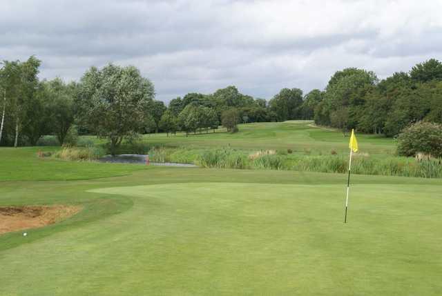 The 4th green and river at Manor Golf Club