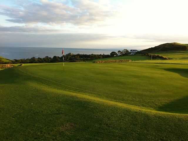 Green overlooking the sea at Criccieth Golf Club
