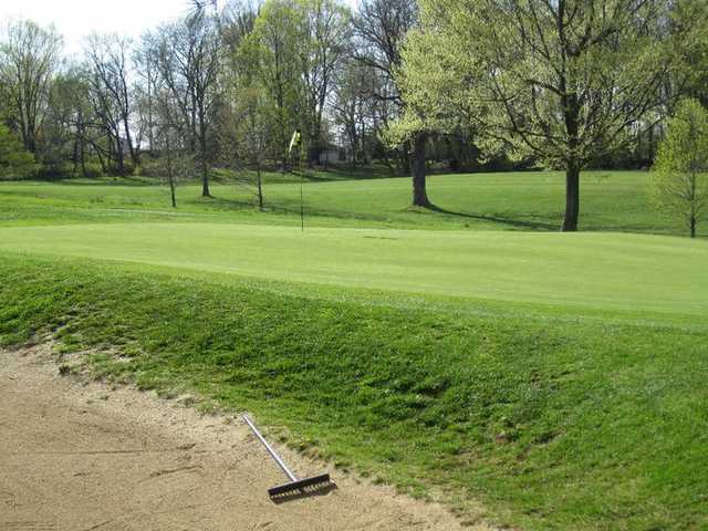 A view of the 10th green guarded by bunkers on both sides at  Middletown Country Club