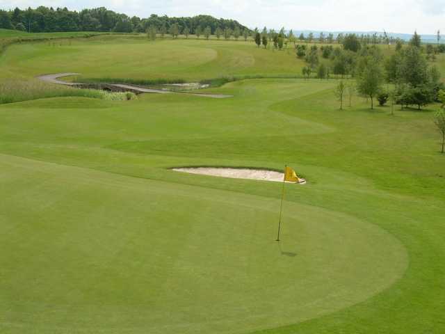 An immaculate green with protective bunker at Forrester Park Resort