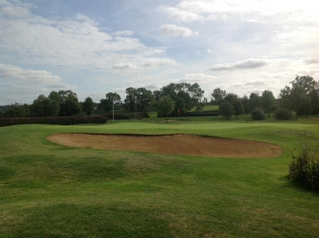 Large bunker protecting the 9th green at Stoke Albany Golf Club