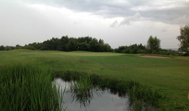 View over the pond of the 7th green at Waterfront Golf Club 