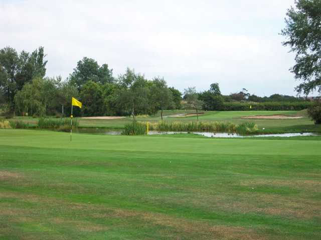 Gently sloping velvet green on Clancton-on-Sea's 16th hole