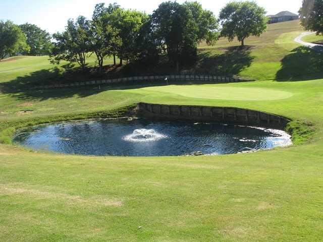 View of a green and pond at Patriot Hills Golf Club