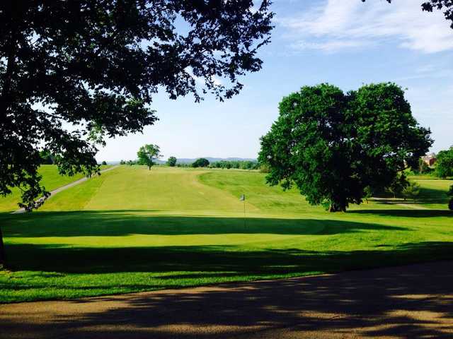 A sunny day view of a hole at Battlefield Golf Club