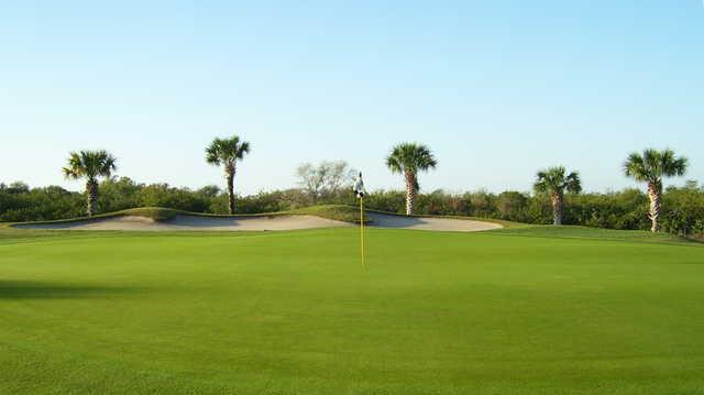 A view of a green with bunker at Viera East Golf Club