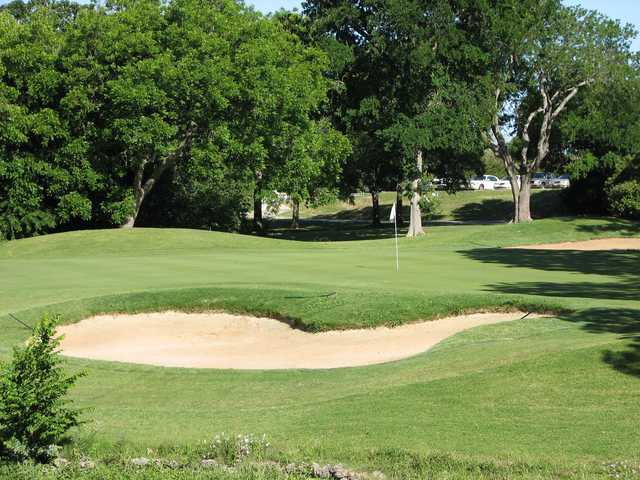 View of a green and bunker at Lost Creek Golf Course
