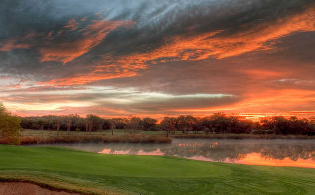 Sunset view of a green at Grey Rock Golf Club