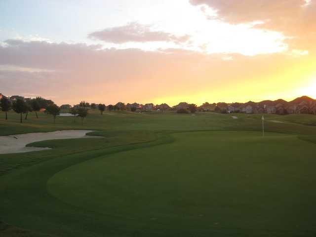 Sunset view of a green at Coyote Ridge Golf Club.