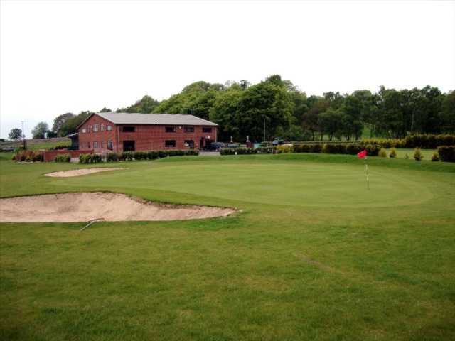 View overlooking the clubhouse and a manicured green at Halfpenny Green