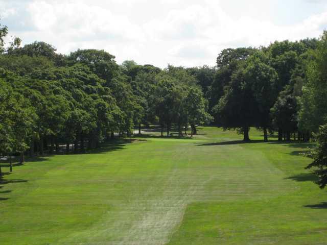 Scenic view of the tree lined 13th hole at Rotherham Golf Club