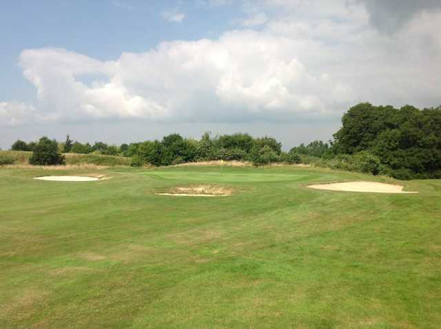 A view of the 12th green and greenside bunkers at Hassocks Golf Club