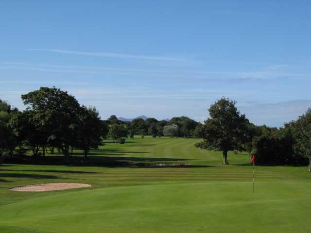 A stunning view of the 15th green and fairway at Caernarfon Golf Club