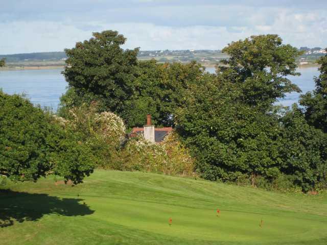 The putting green overlooking the sea at  Caernarfon Golf Club