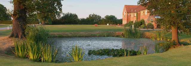 Stunning view over the pond to the clubhouse 
