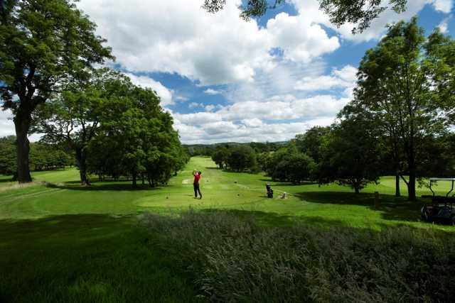 View down the tree lined fairway of the 12th at Tytherginton Golf Club