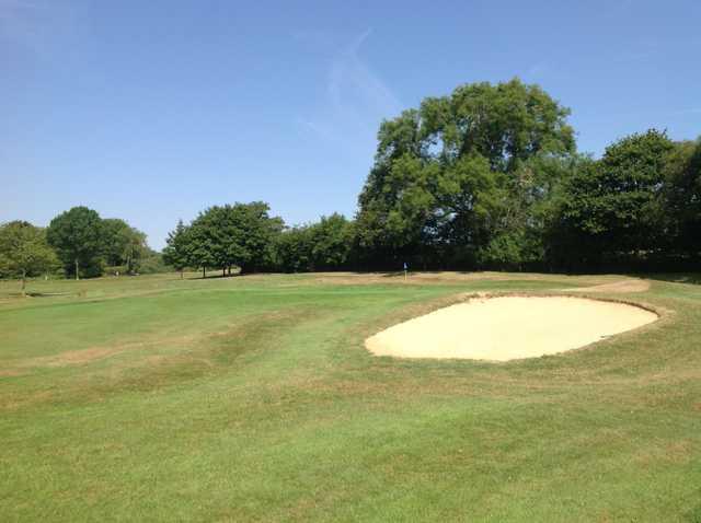 A view of the 17th green and greenside bunker at Hamptworth Golf Club