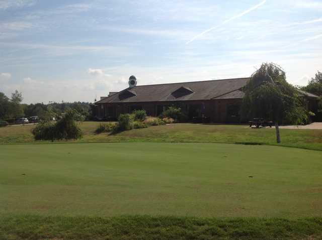 A view of the putting green and clubhouse at Hamptworth Golf Club
