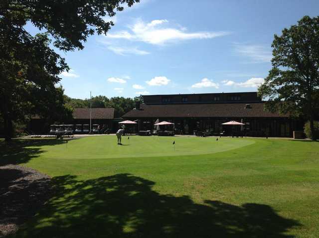 View of the putting green and pro shop at Leatherhead Golf Club 