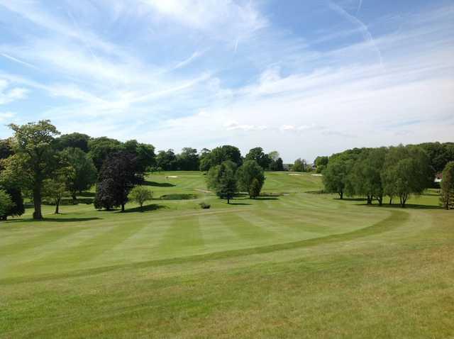 The well-kept fairway leading to the 10th green at Shaw Hill Golf Club