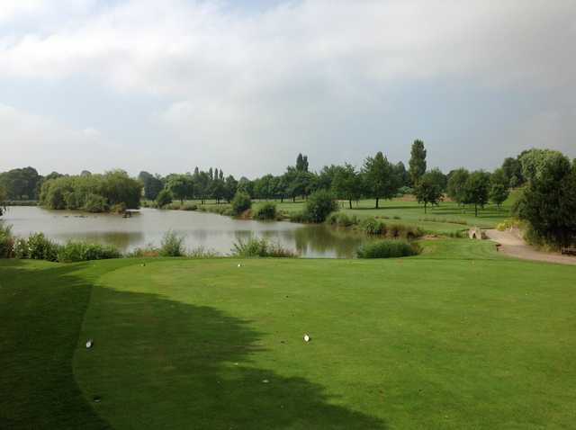 A view of the 14th hole and neighbouring lake at Windmill Village Golf Club