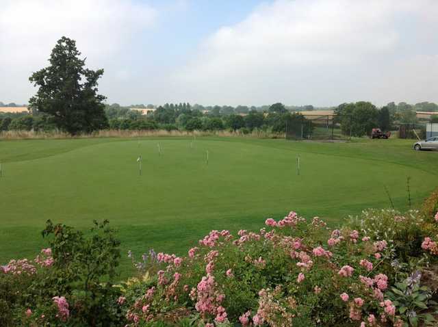  A view of the putting green and surrounding countryside at Windmill Village Golf Club