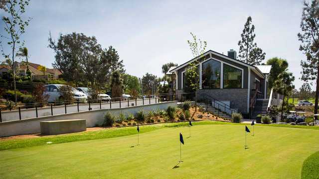 A view of the practice putting green and clubhouse from The Executive Course at Lakehouse