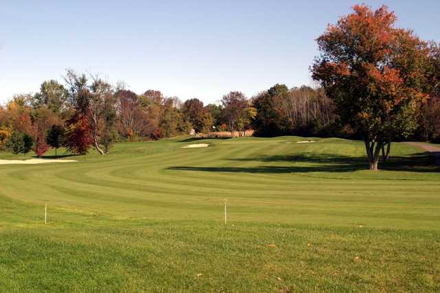 Fall view of a fairway and green at Blackledge Country Club
