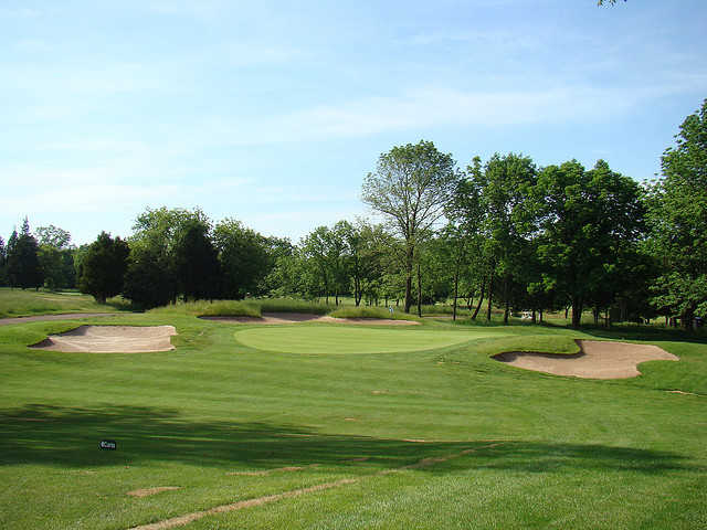 A view of a bunkered green at Quail Brook Golf Course