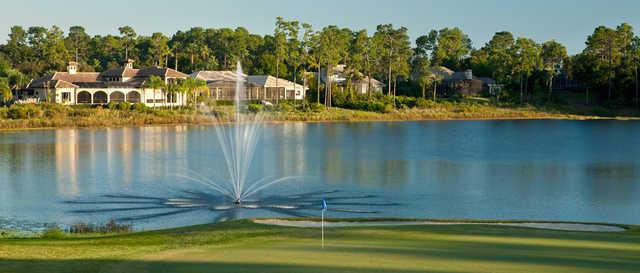 View of a green and lake at DeBary Golf and Country Club