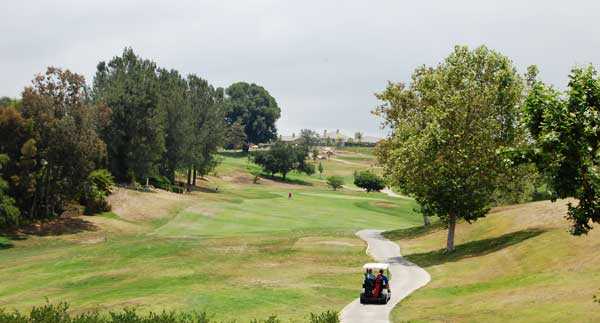 A view of a hole with narrow path on the right at Boulder Oaks Golf Club