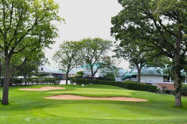 A view of the 9th green protected by bunkers at Elgin Country Club