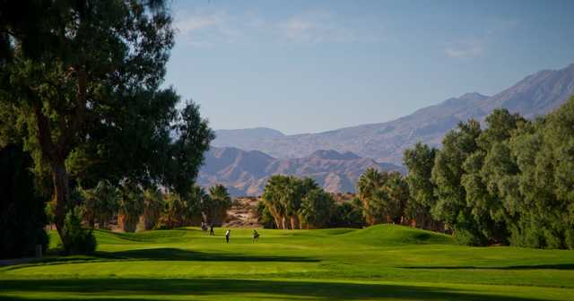 View of a fairway and green at Desert Dunes Golf Course