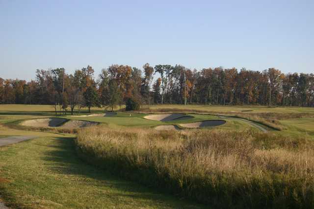 A view of a green defended by a collection of bunkers from The Links at Kokopelli.