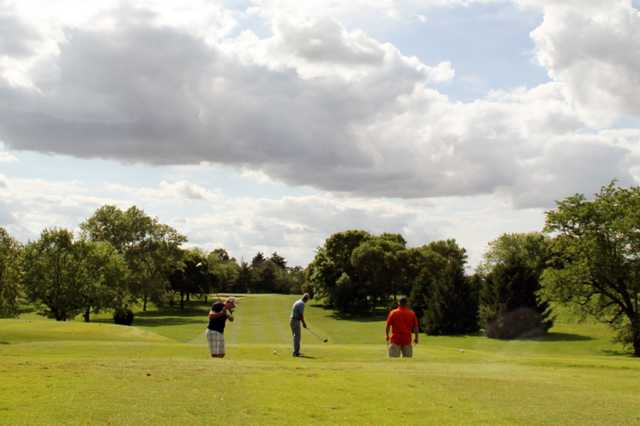 A sunny day view of a trio golfers at Westview Golf Course