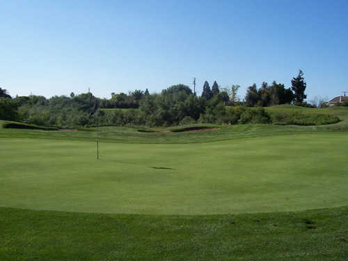 A view of the 11th hole with bunker in background at Castle Oaks Golf Club