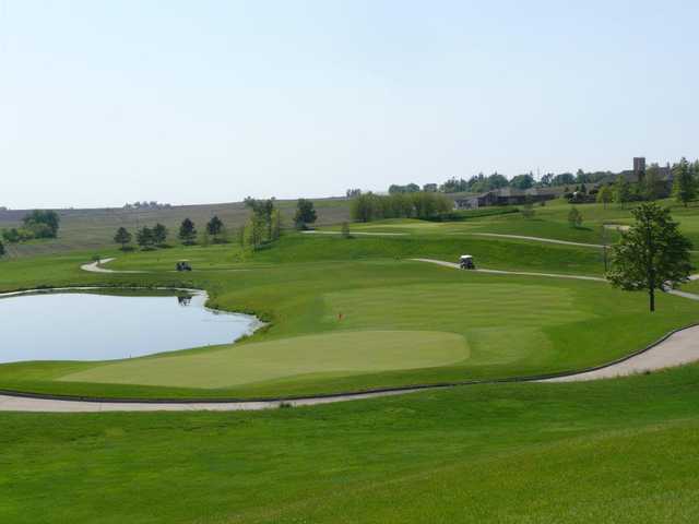 A view of a green with water coming into play at Stone Creek Golf Club