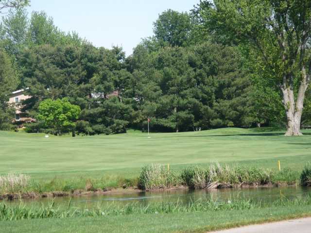 A sunny day view of a hole at Stone Creek Golf Club