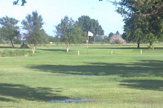 A sunny day view of a green at Tee Time Golf & Cafe