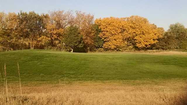A fall day view of a green at Indian Hill Golf Course