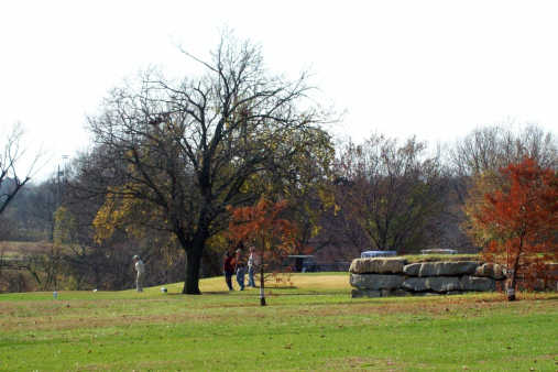 A fall day view of a tee at Garnett Country Club