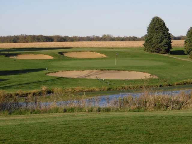 A view of green at Shambolee Golf Club with bunkers in background