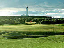 The view from the 11th hole at Moray is pure Scotland, lighthouse included ( Photo by K. Boncella )