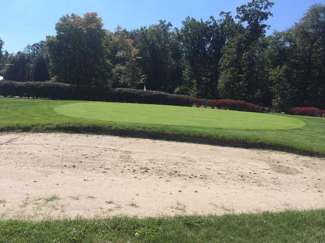 View of a green and bunker at Tanglewood Golf Course