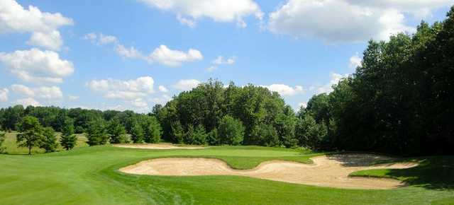 A view of green #17 surrounded by bunkers at The Woodlands Course at Whittaker